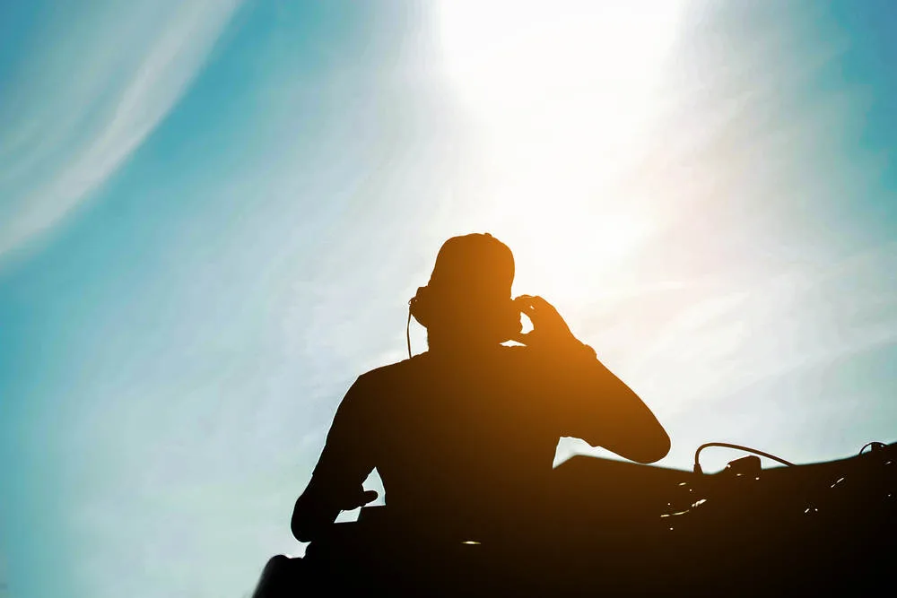 djing man in the sunset